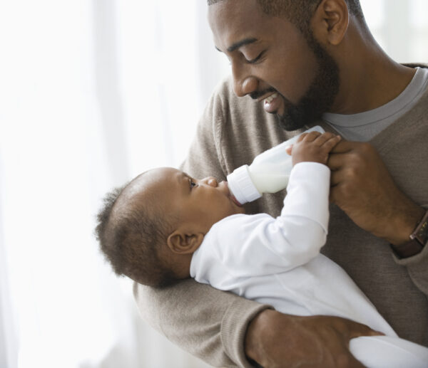 Father feeding son